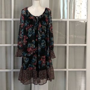 Floral black dress with ruffle.